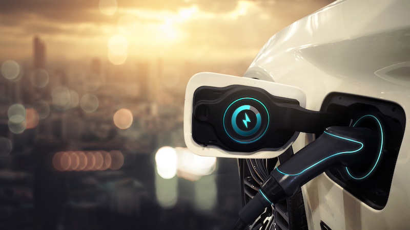 Hybrid electric car charging power battery using pump cable, visual graphic banner copyspace blue city sunset bokeh background modern futuristic concept. Innovative eco energy resources fuel vehicle.